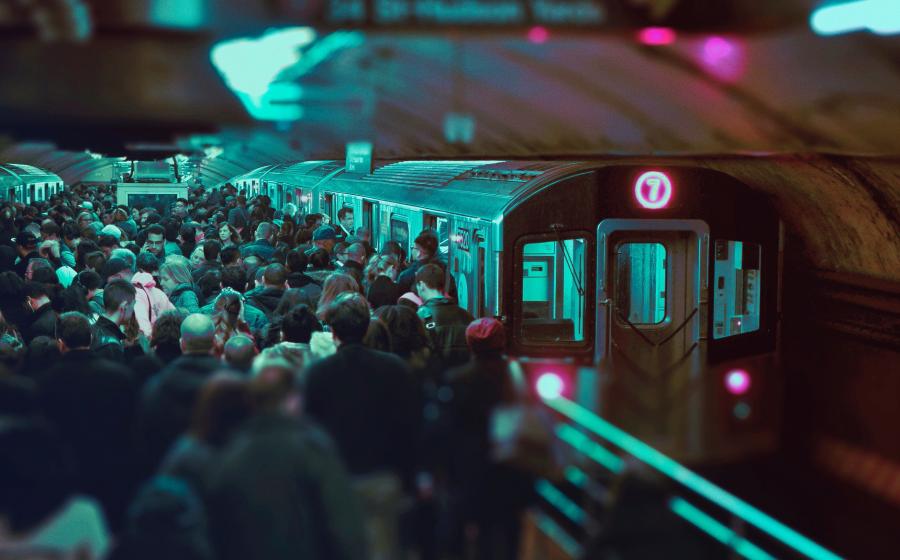 People crowding to get onto a train