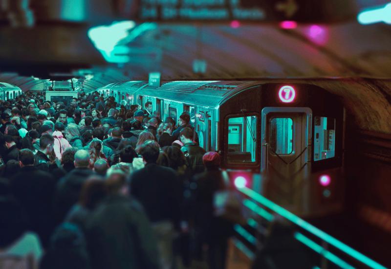 People crowding to get onto a train